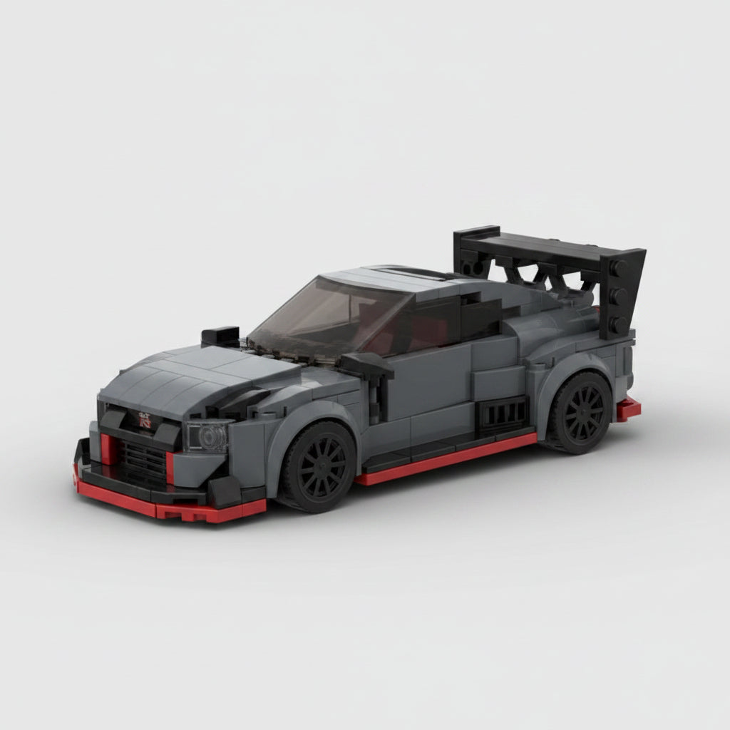Black and red toy car made of interlocking bricks on a white background